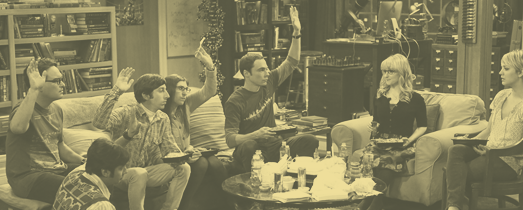 The cast of The Big Bang Theory sat in the Big Bang Theory set